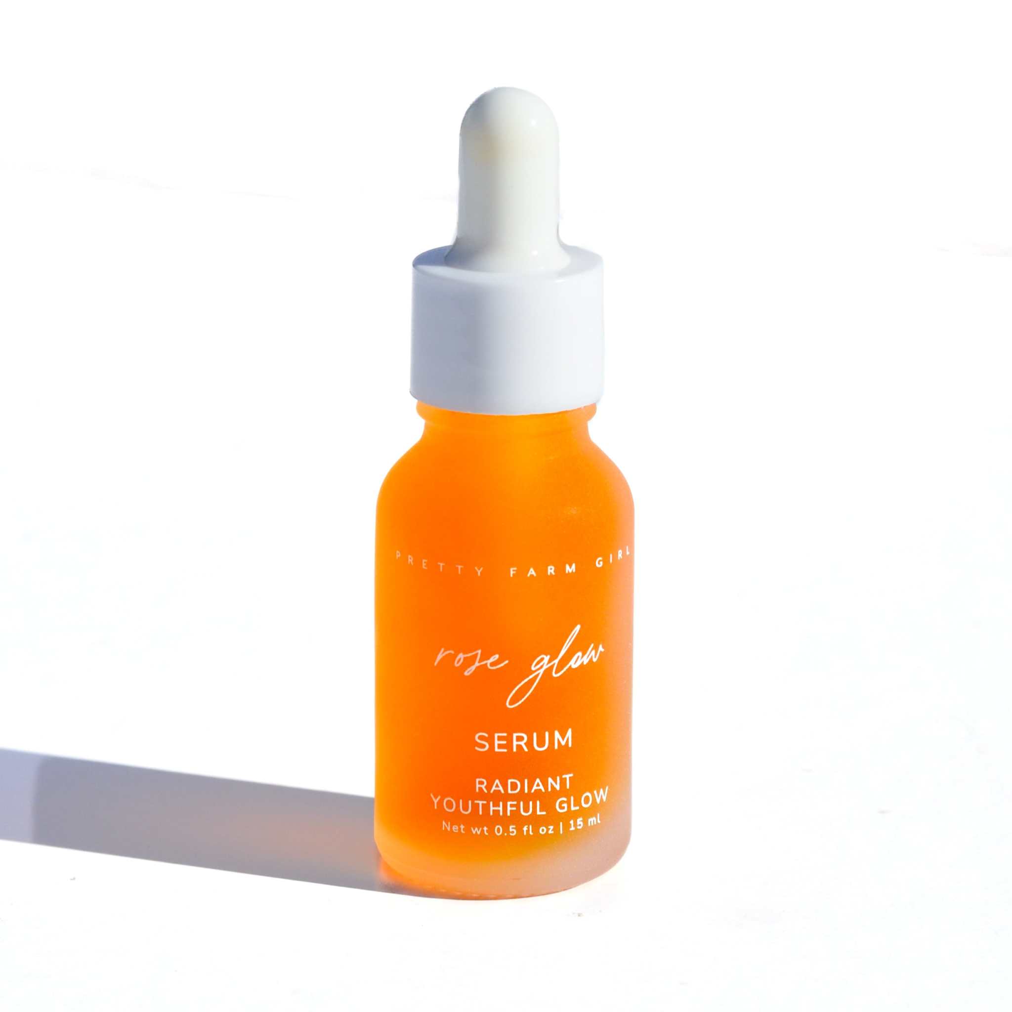 Double Cleansing Anti Aging Kit rose glow serum in an orange glass dropper bottle with white cap