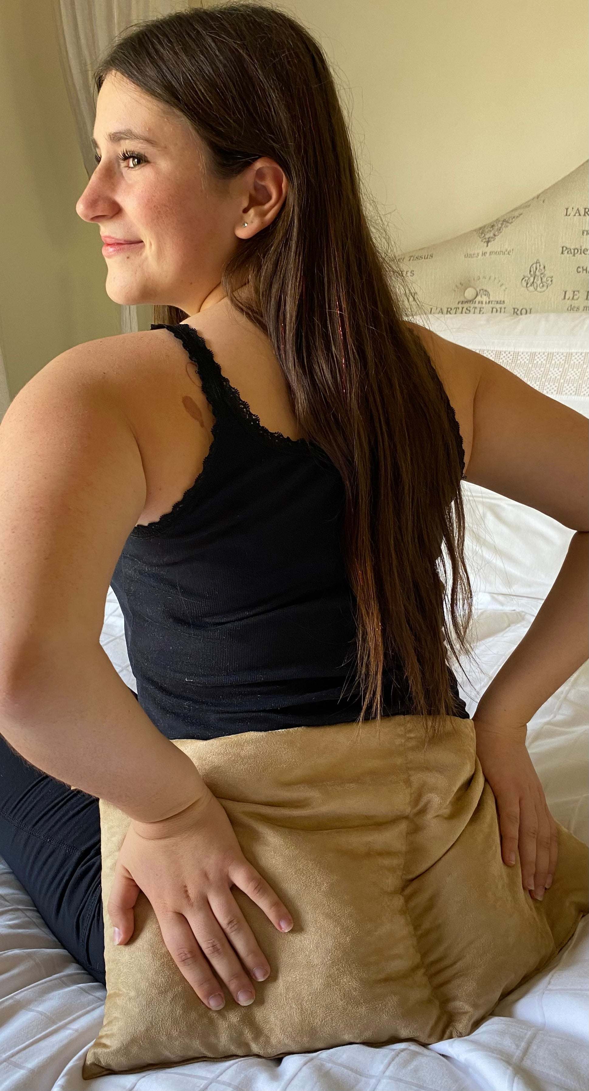Double Square Cherry Stone Pillow in tan ultra-suede, a soft rectangular cushion held across the lower back