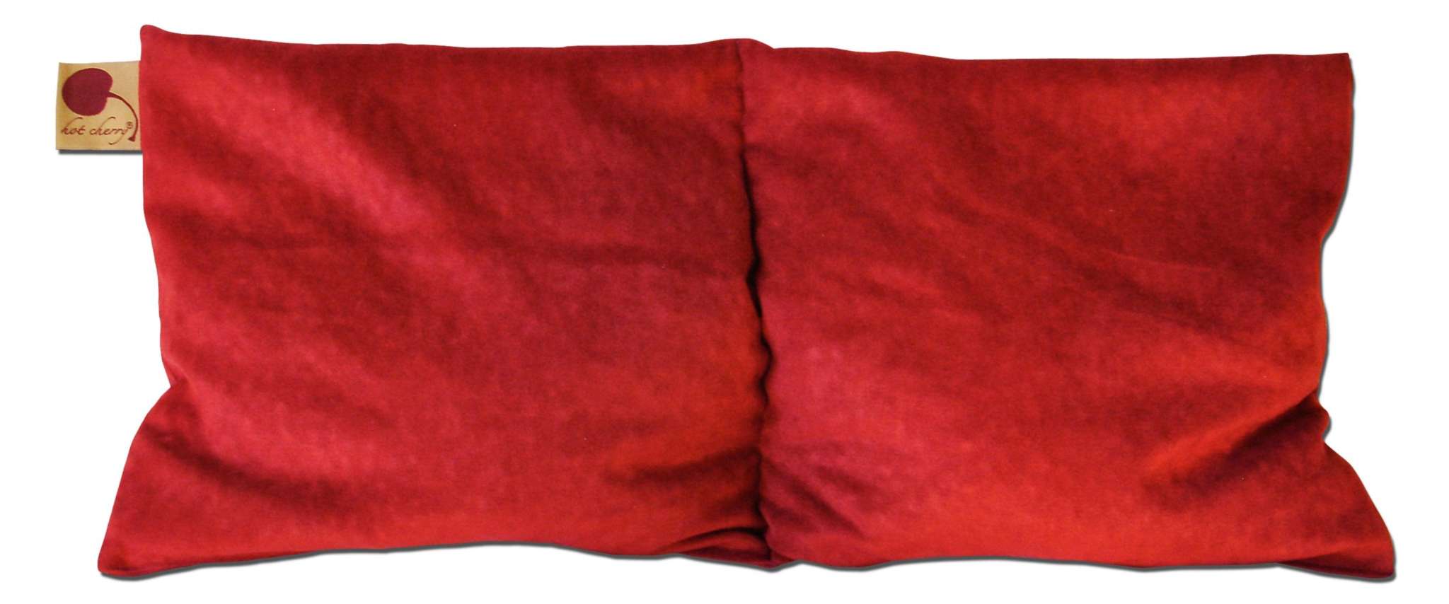 Double Square Pillow in plush red ultra-suede, with two broad padded sections and a small fabric tag