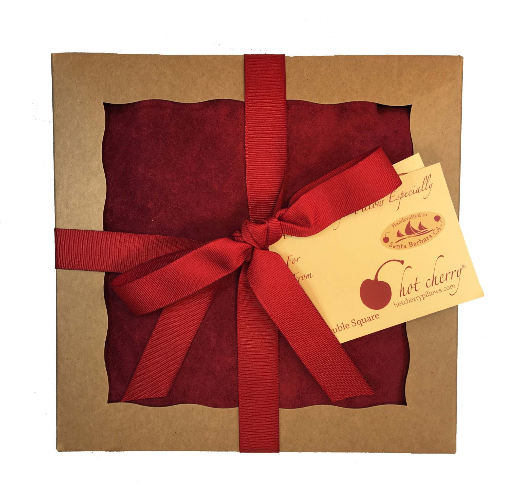 Double Square Pillow in deep red plush fabric, tied with a matching ribbon and presented in a kraft gift box