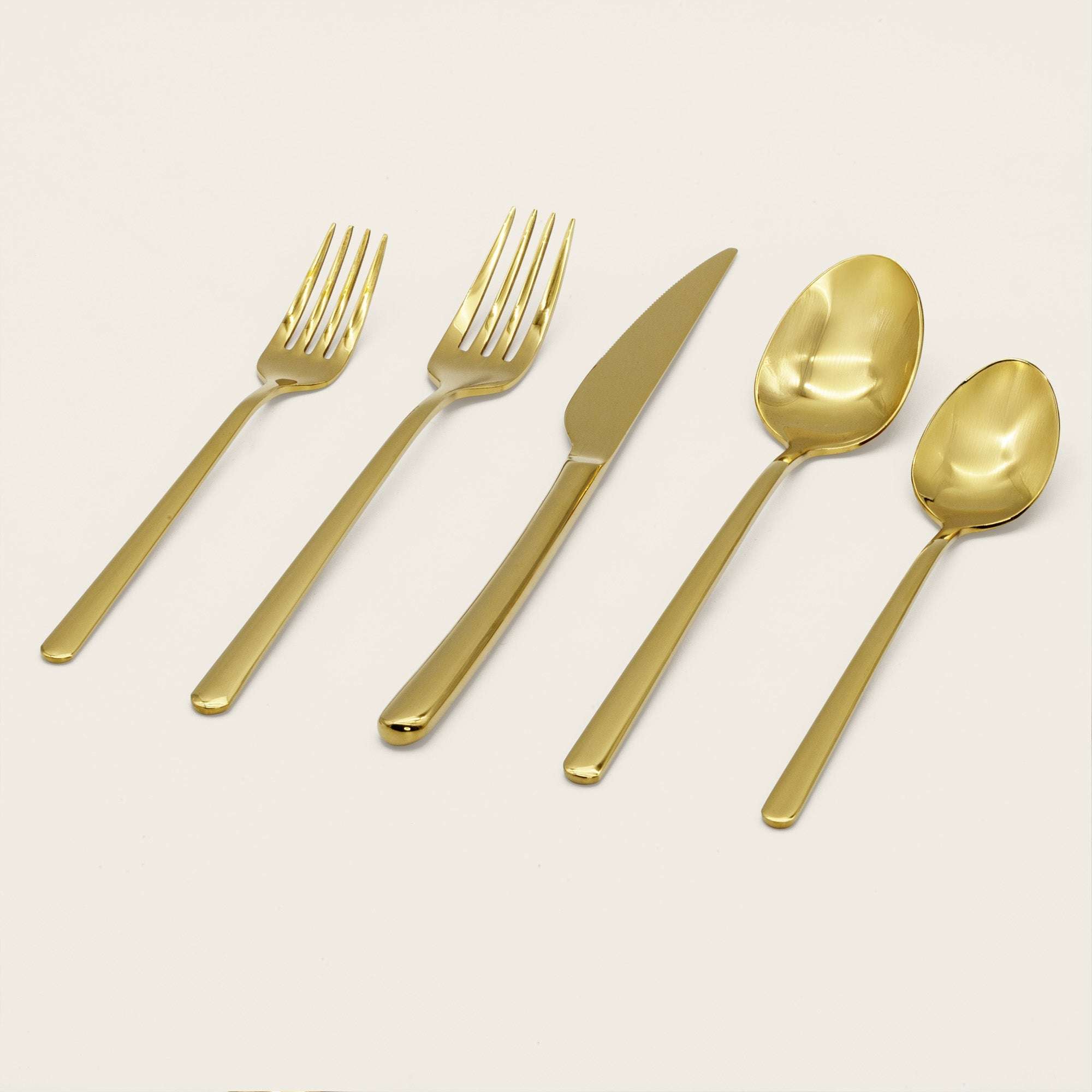 Emilia Mirror 20-Piece Flatware Set in gold-tone stainless steel with polished mirror finish and sleek contemporary lines