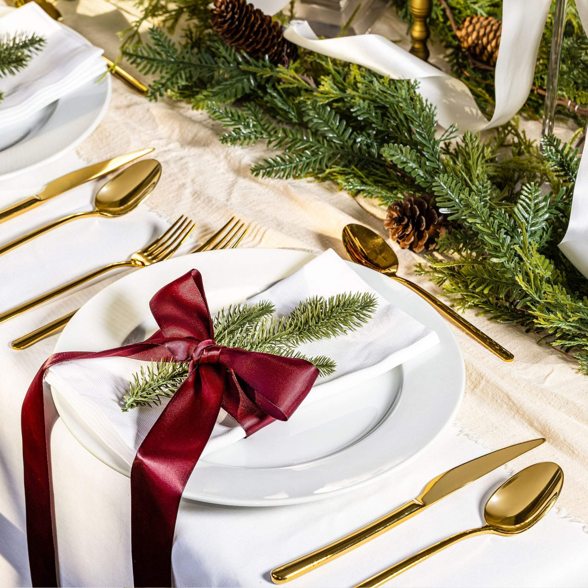 Emilia Mirror 20-Piece Flatware Set with polished gold-tone stainless steel cutlery and sleek contemporary lines
