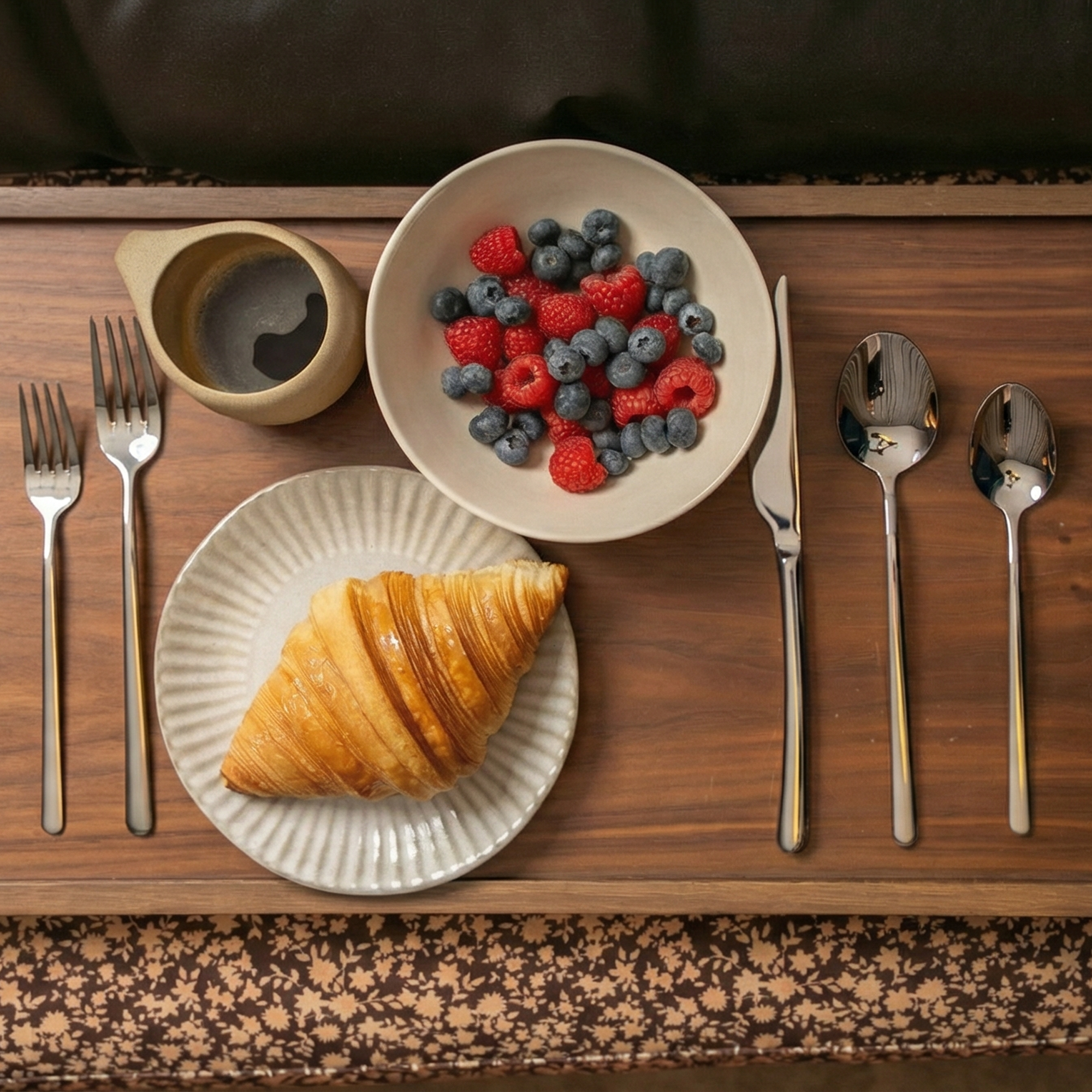 Emilia Mirror 20-Piece Flatware Set with polished silver stainless steel forks, knife and spoons in clean contemporary lines