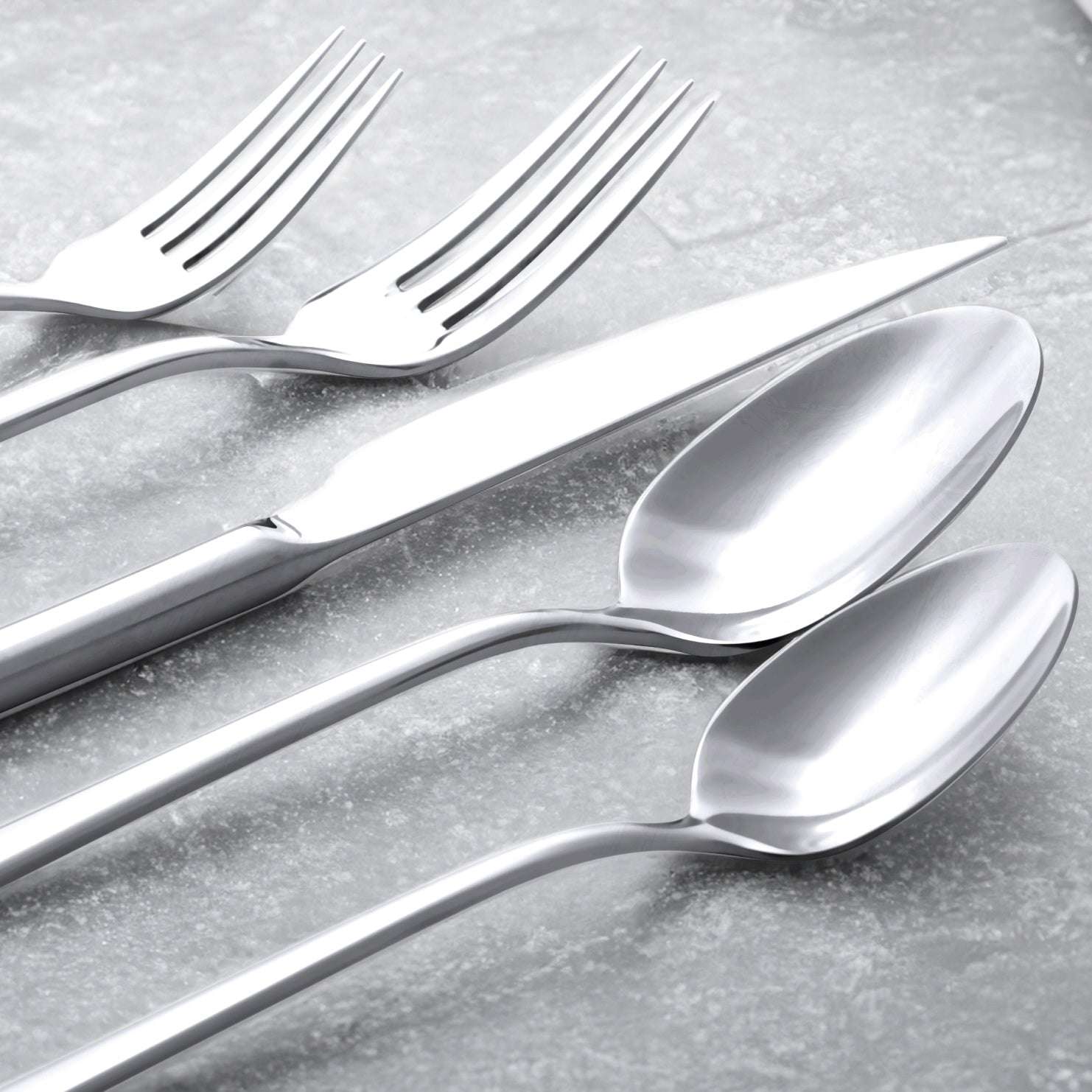 Emilia Mirror 20-Piece Flatware Set with polished silver stainless steel forks and spoons, featuring sleek contemporary handles