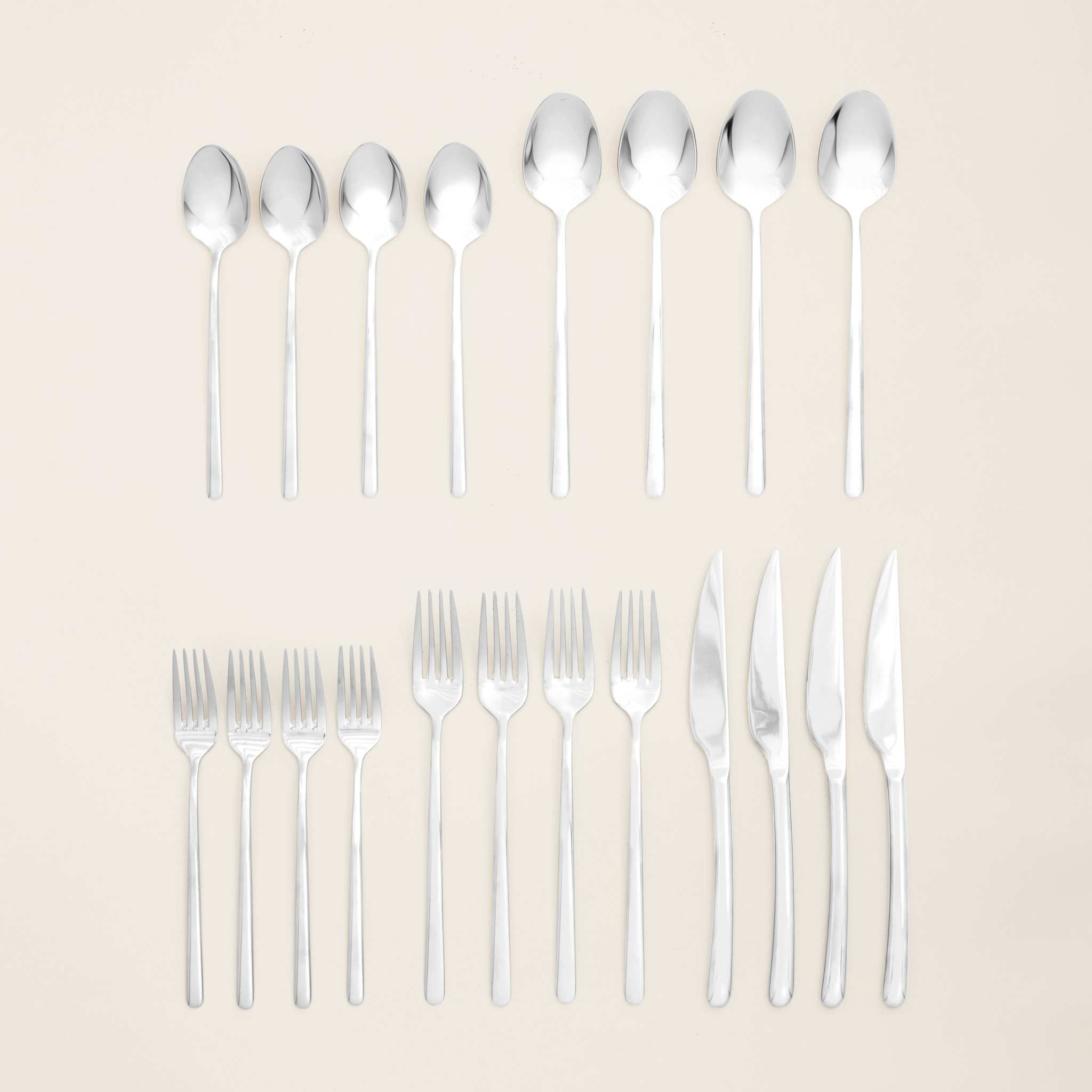 Emilia Mirror 20-Piece Flatware Set in polished silver stainless steel, with sleek contemporary lines and four each of five pieces