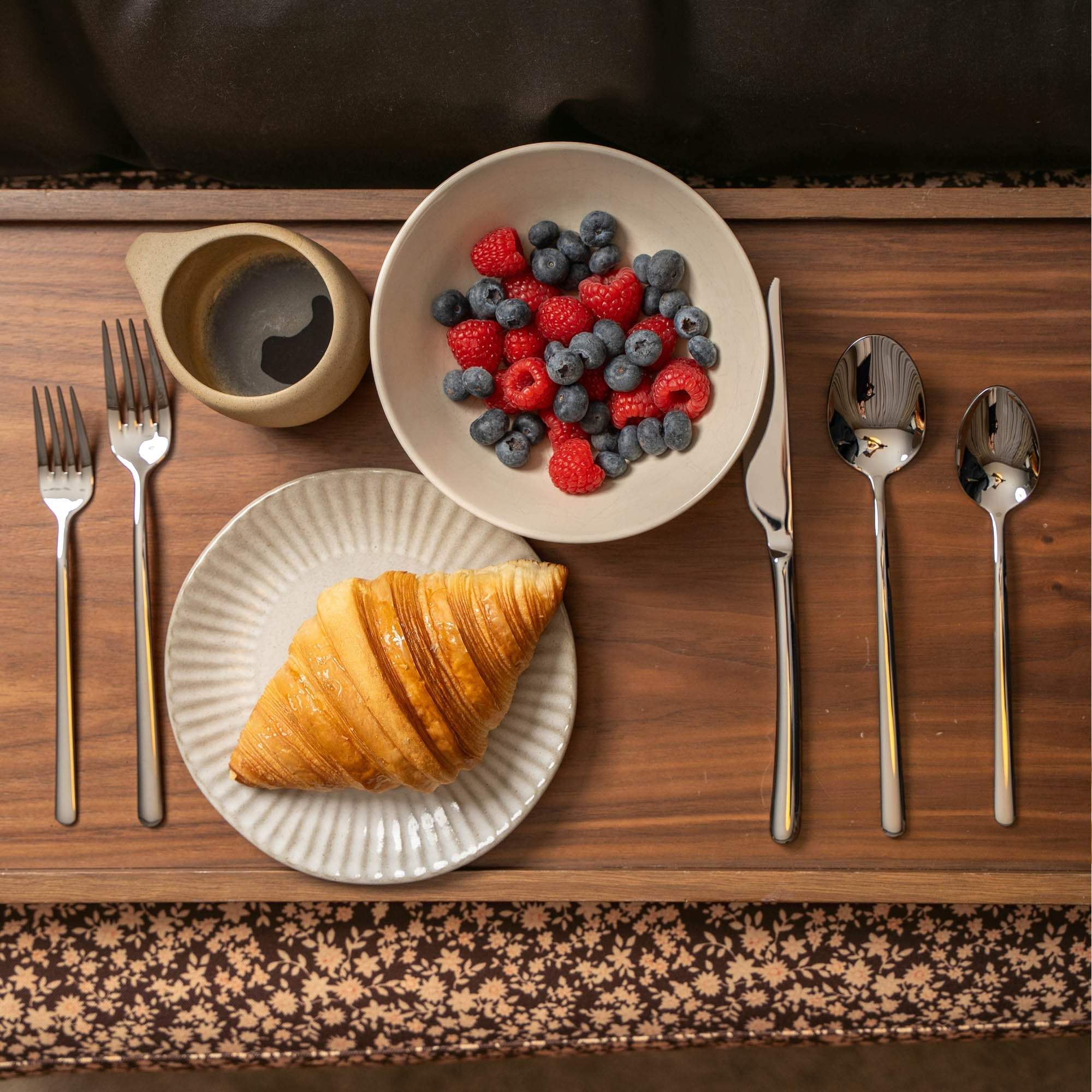 Emilia Mirror 20-Piece Flatware Set, polished silver stainless steel knife, forks and spoons with sleek contemporary handles