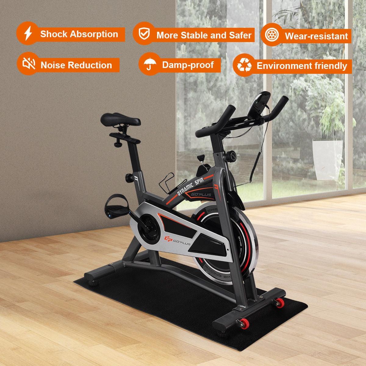 Equipment Mat for Home in black thick high-density PVC with textured non-slip surface under a stationary exercise bike