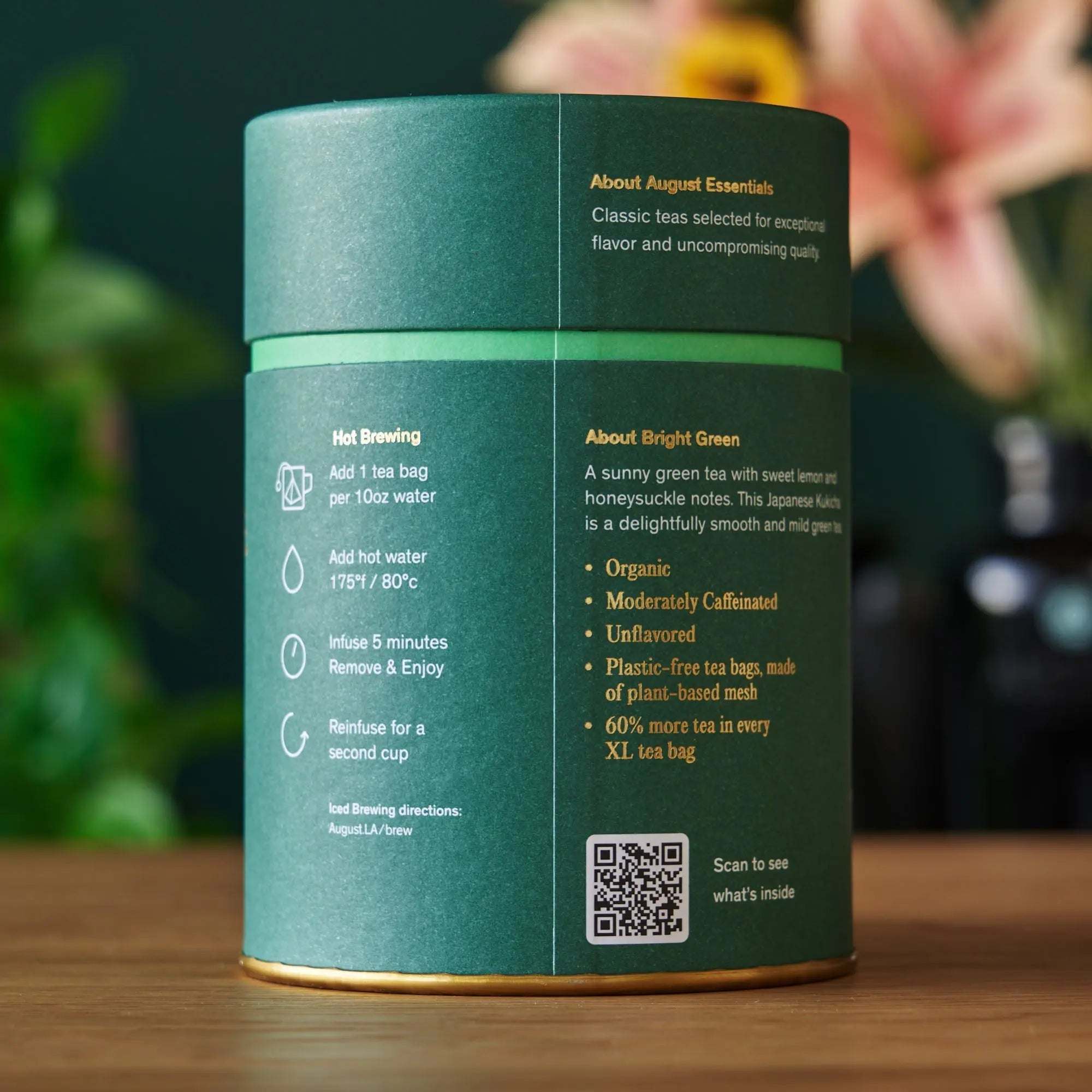 Essentials Bright Green Tea canister in teal paper, featuring green tea details and gold botanical accents
