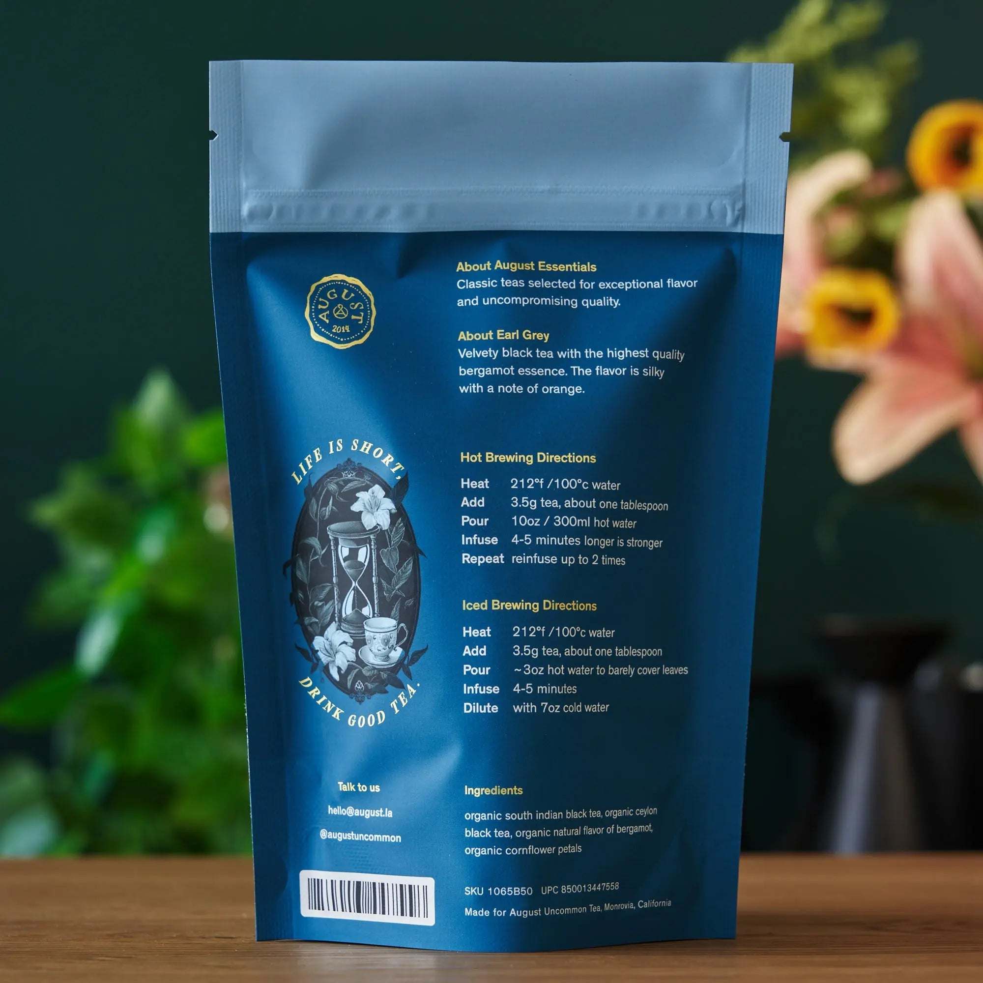 Essentials Earl Grey Black Tea in a blue resealable pouch with floral artwork and brewing instructions