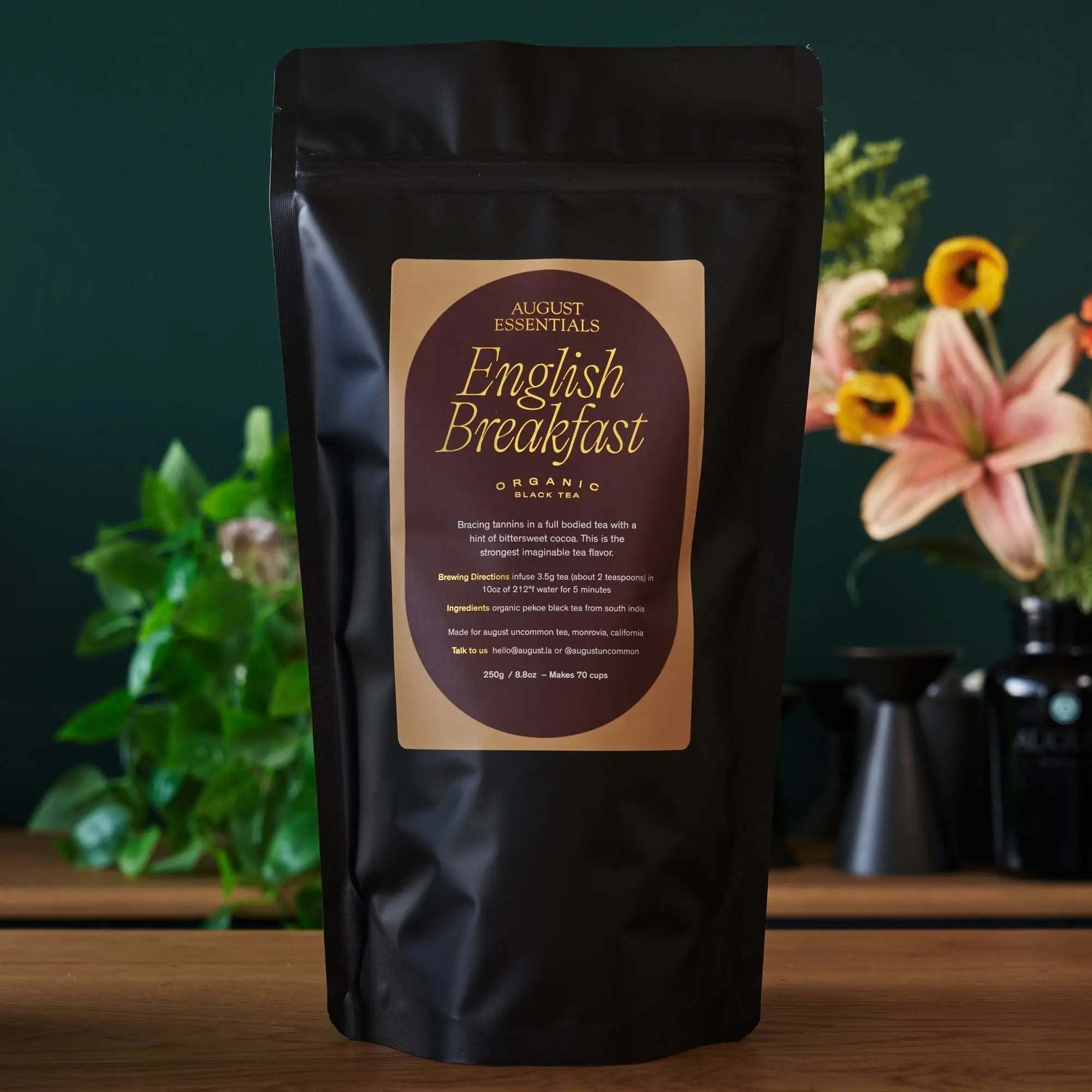 Essentials English Breakfast Black Tea in a matte black resealable pouch with a tan label and gold lettering