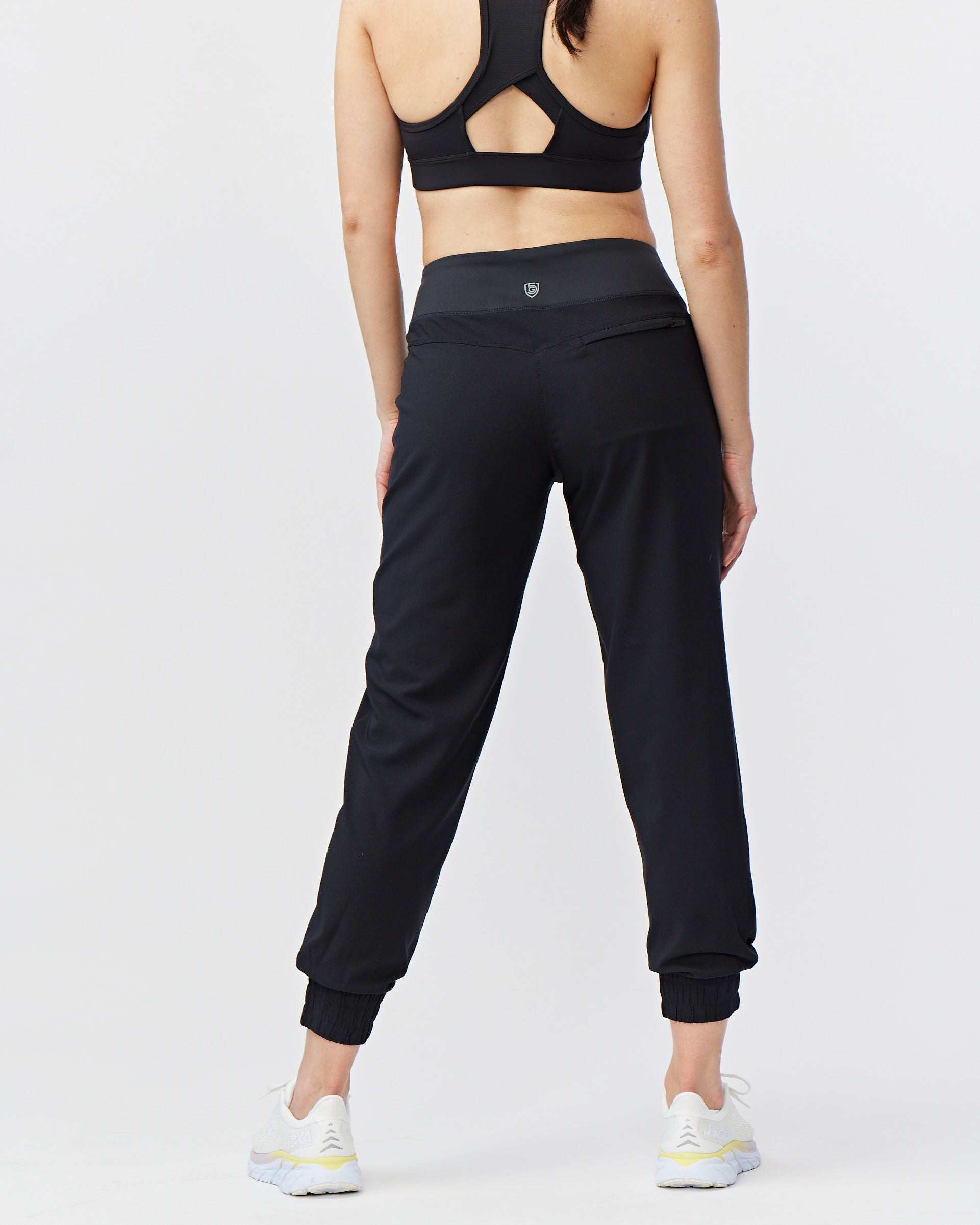 Excel Jogger black 7/8-length pants in smooth stretch fabric, with a high waistband and elastic ankle cuffs