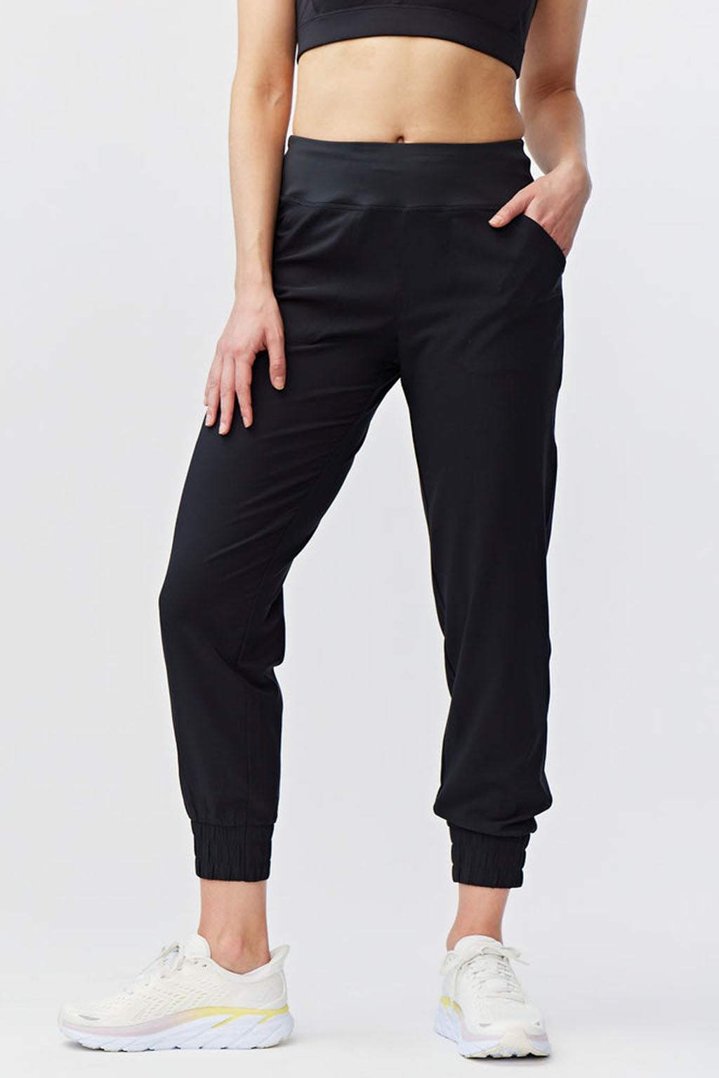 Excel Jogger black woven pants with a smooth finish, relaxed lower legs, elastic ankle cuffs and side pockets