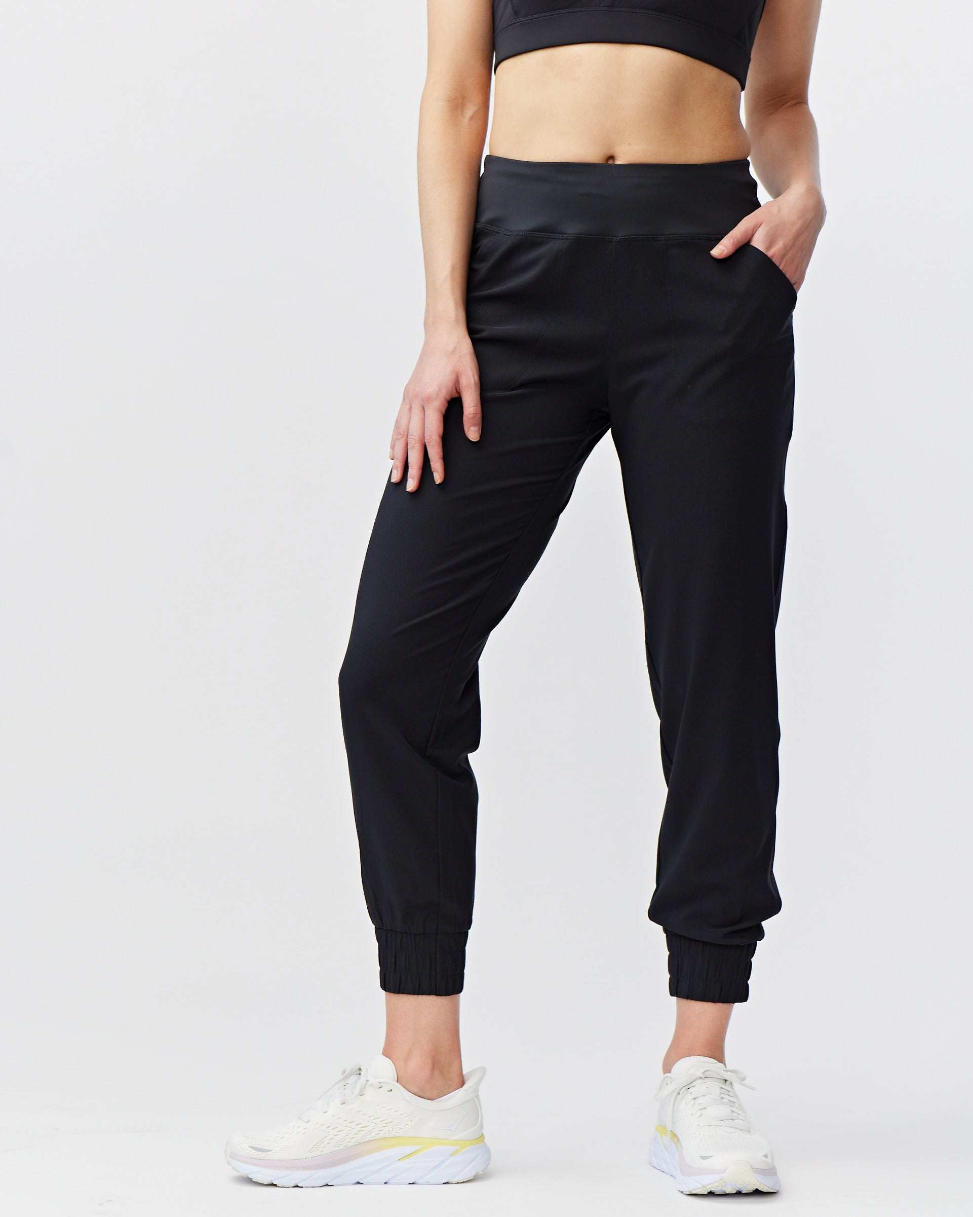 Excel Jogger black woven pants with a smooth finish, relaxed leg and stretchy elastic cuffs at the ankles