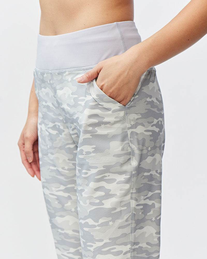 Excel Jogger pants feature a grey and white camouflage pattern, wide white waistband and side pockets.