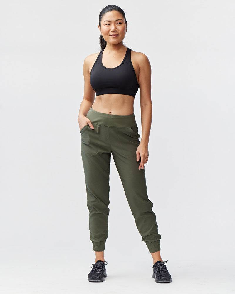 Excel Jogger pants in olive green woven fabric, with a relaxed tapered fit, side pockets and elastic ankle cuffs