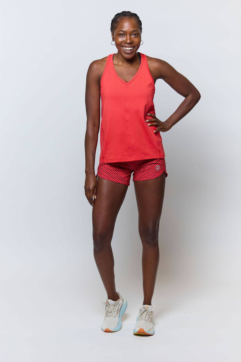 Excel Women's Workout Shorts in red with a black diagonal stripe pattern and a fitted athletic cut