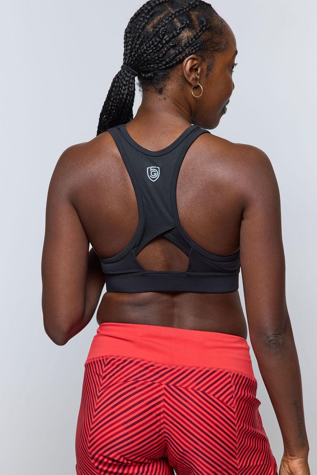 Excel Women's Workout Shorts, bright coral red with a black geometric zigzag pattern and fitted waistband