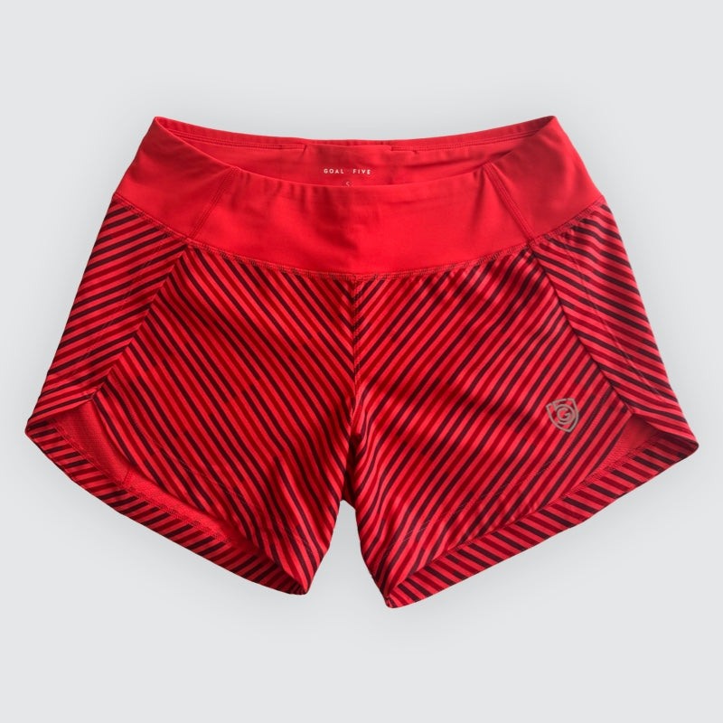 Excel Women's Workout Shorts in red stretch fabric with black diagonal stripes, a wide waistband and overlapping side panels