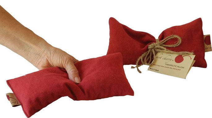 Eye Pillow in Red Denim made of soft, durable red fabric with a natural twine bow and a label, designed for heat or cold therapy