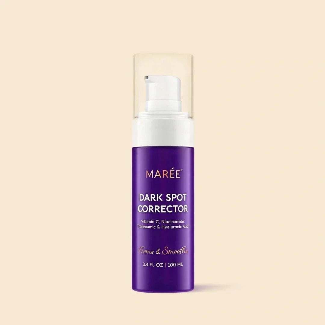 Face & Body Serum in a purple bottle with a white pump and clear cap, labeled Marée Dark Spot Corrector