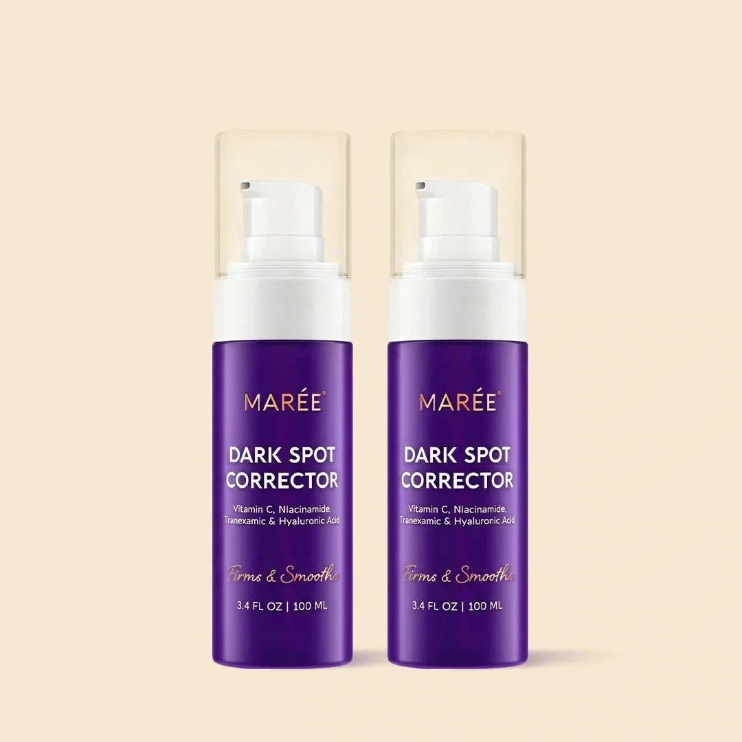 Face & Body Serum in two purple Marée Dark Spot Corrector bottles with white pump tops and clear caps