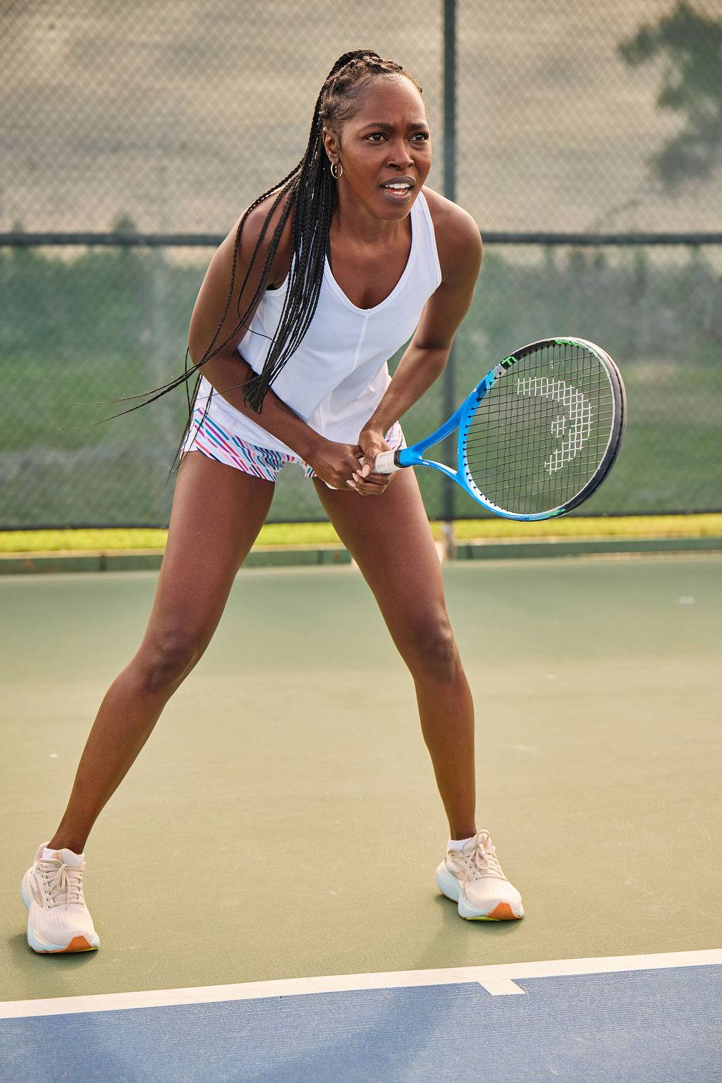 Fast & Free Women's Workout Shorts are fitted multicolour striped shorts with a wide waistband, worn for tennis