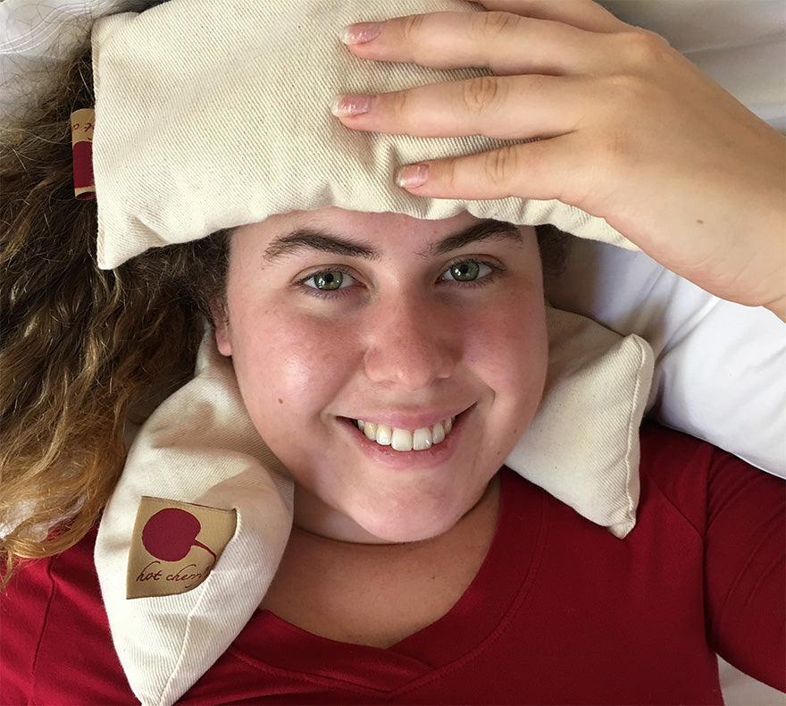 Feel Better Pack with natural cream fabric eye pillow and neck wrap featuring red heart labels for soothing comfort
