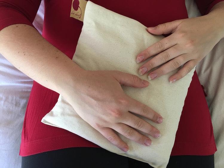 Feel Better Pack with a soft natural cream fabric square, featuring a simple plain finish and visible stitched edges
