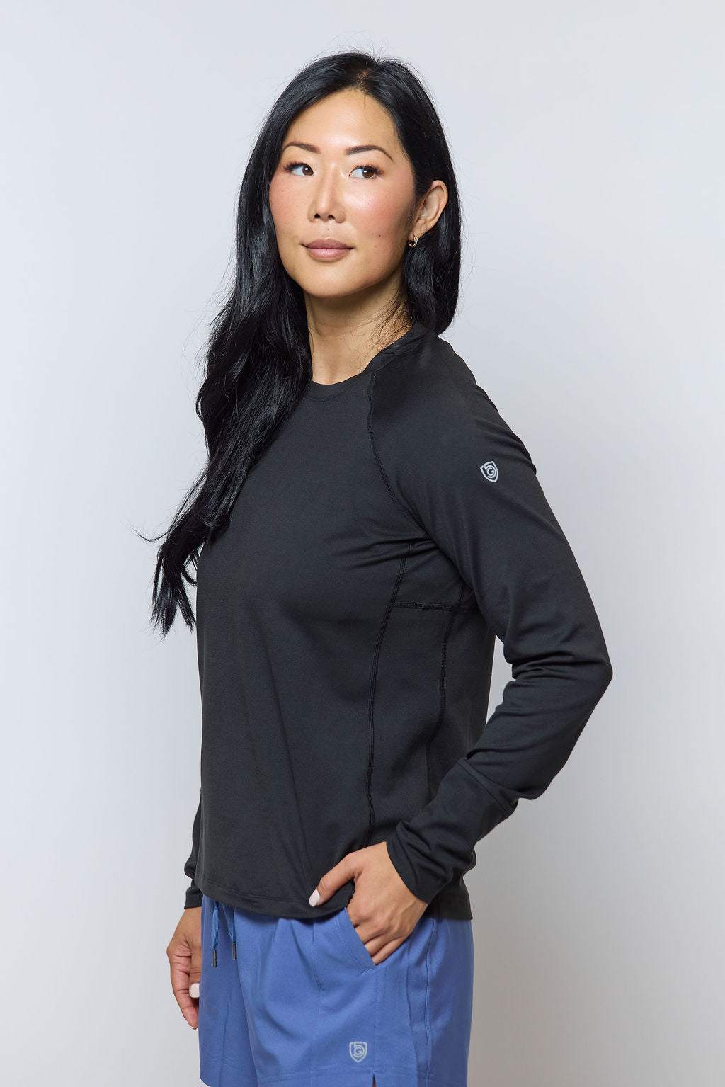 Foudy 2.0 Women's long sleeve athletic top in black, with a crew neckline and small sleeve emblem