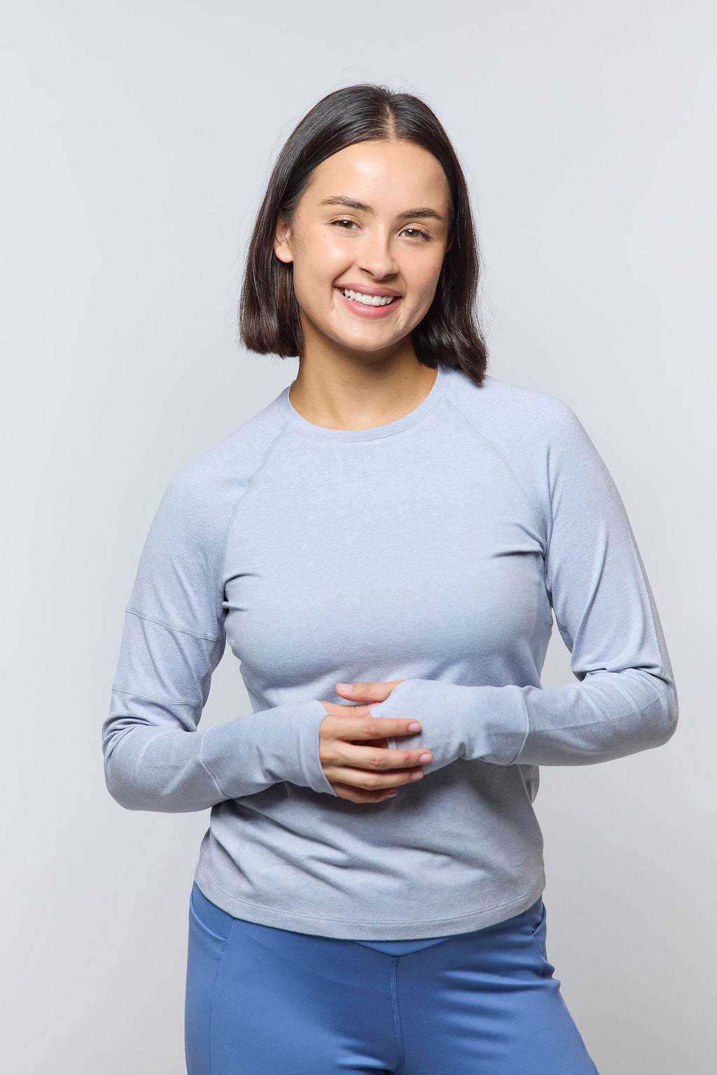 Foudy 2.0 Women's long sleeve athletic top in pale blue, with a crew neckline and fitted cuffs with thumb loops