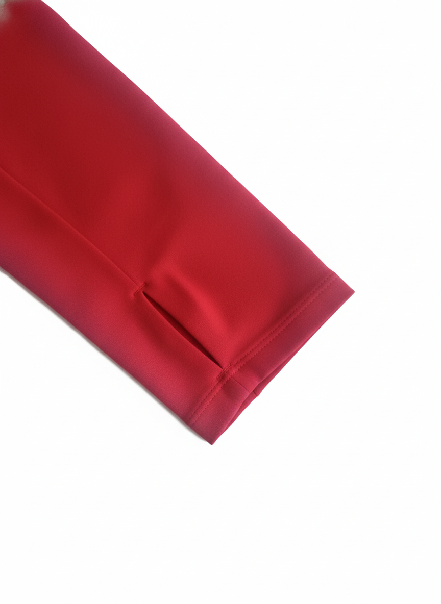 Foudy Mid-Weight Long Sleeve top sleeve in deep red, smooth performance fabric with a discreet thumbhole cuff