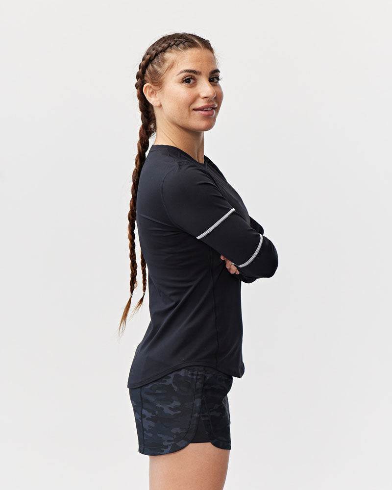 Foudy Women's Longsleeve black workout top with long sleeves and a light captain's seam detail on the upper arm
