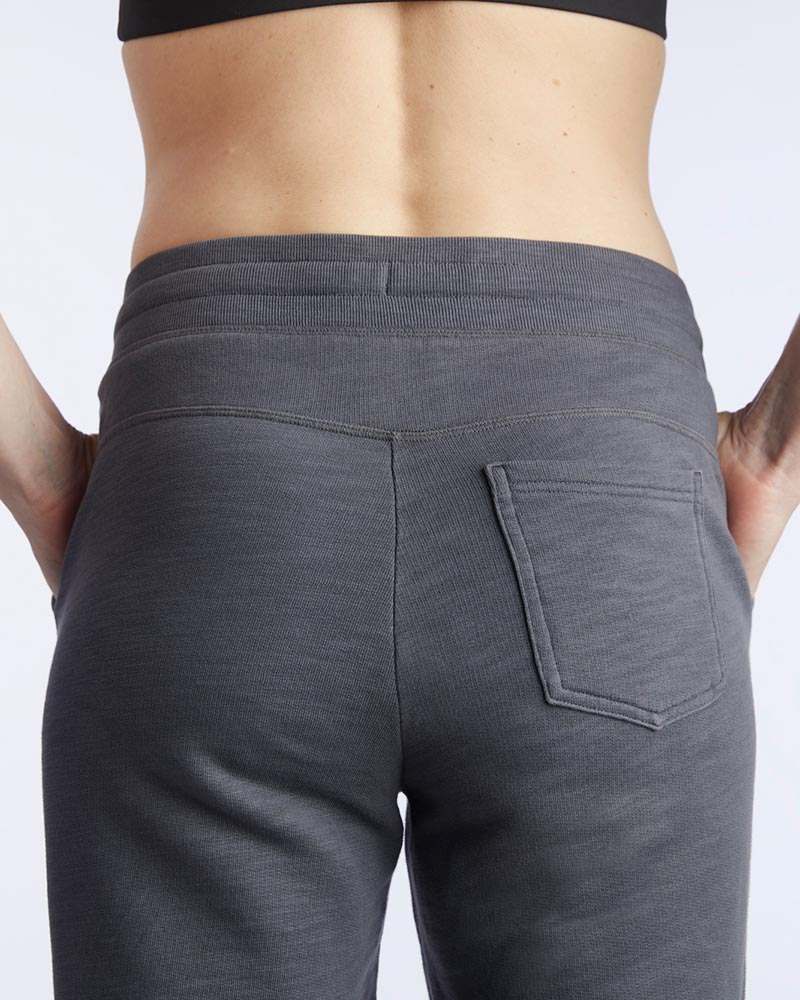 Freasy Jogger in charcoal gray soft knit fabric, shown from the back with an elastic waistband and patch pocket