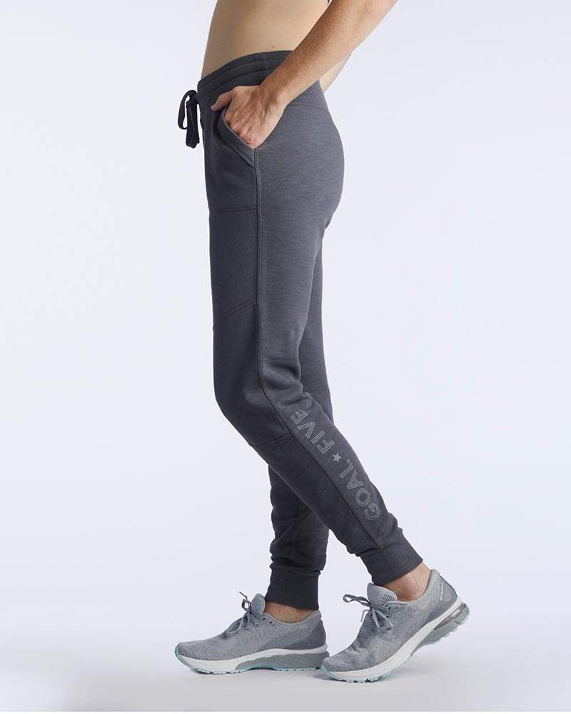 Freasy Jogger in charcoal gray soft fabric, with a black drawcord waistband, tapered legs and ribbed ankle cuffs