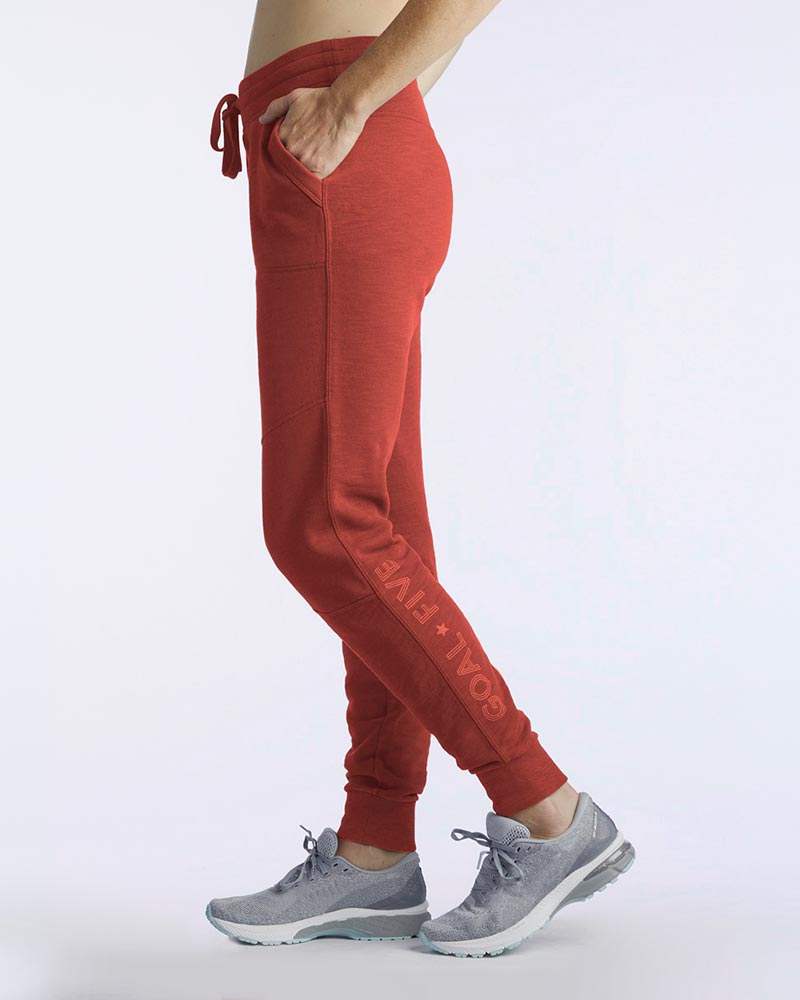 Freasy Jogger in red lightweight fabric with a drawstring waist, side pockets, tapered legs and ribbed cuffs