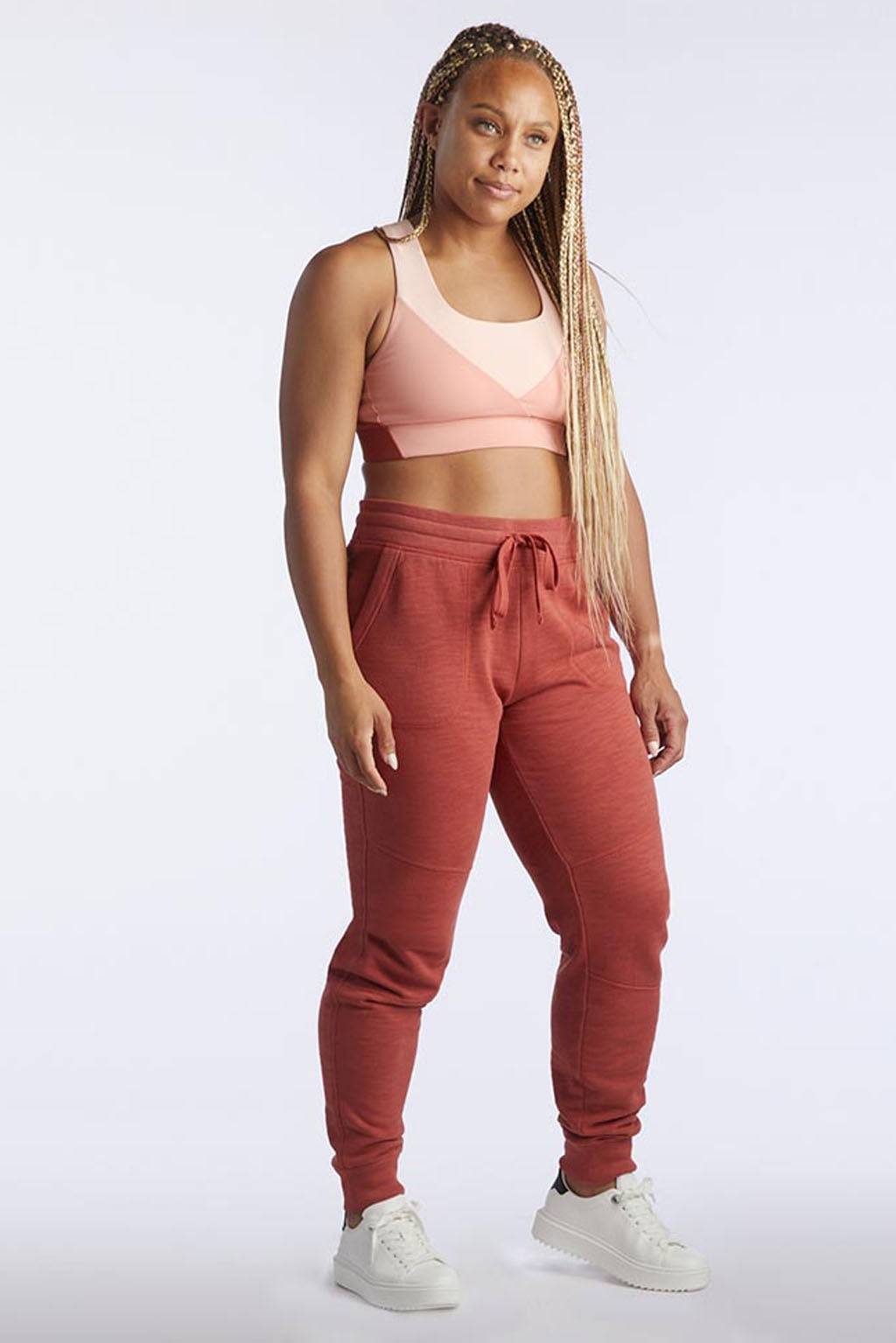 Freasy Jogger in rust-red lightweight fabric, with a braided drawcord waist and tapered ribbed ankle cuffs