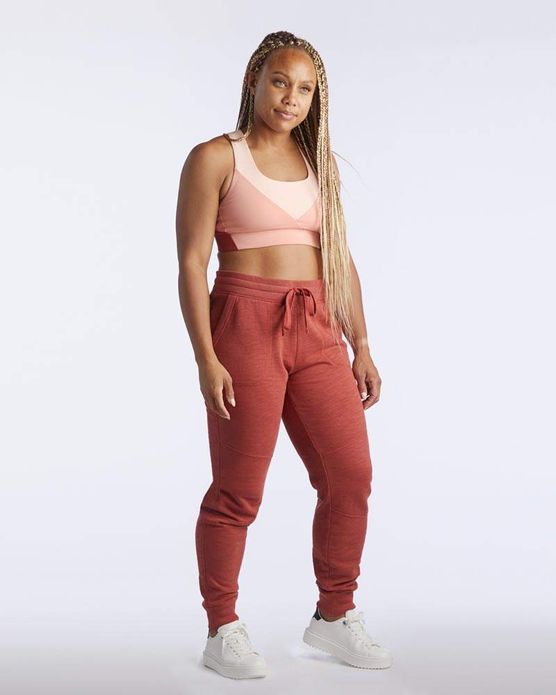 Freasy Jogger in rust red with a soft, solid-color finish, elastic drawstring waist and tapered ribbed cuffs