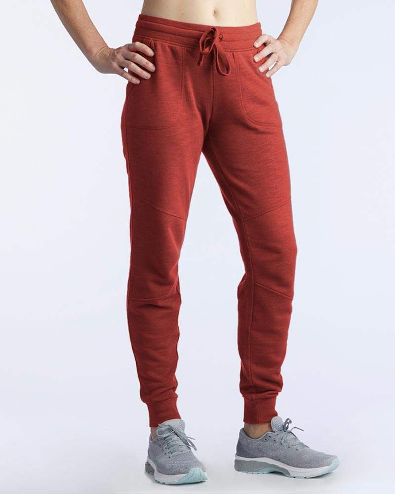 Freasy Jogger in rust red with a soft knit finish, elastic drawstring waistband, side pockets and tapered ribbed cuffs