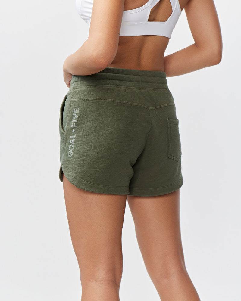 Freasy Short in olive green cotton with a wide rib-knit waistband, rear pocket and vertical logo detail