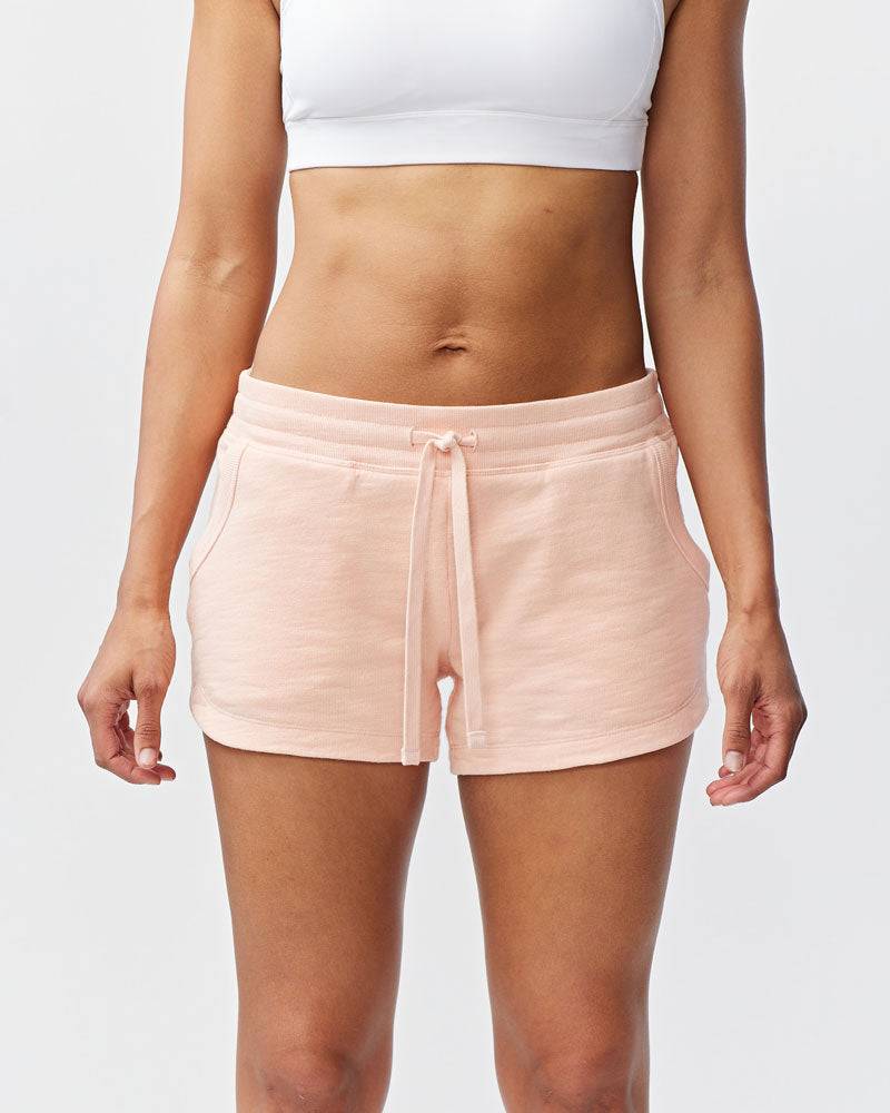 Freasy Short in pale peach cotton with a wide rib-knit waistband, drawstring, and front pockets