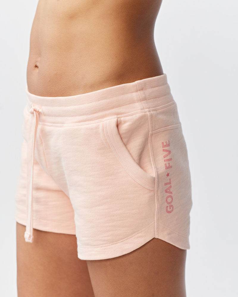 Freasy Short in pale pink cotton with a wide ribbed waistband, drawstring, front pocket and vertical side print
