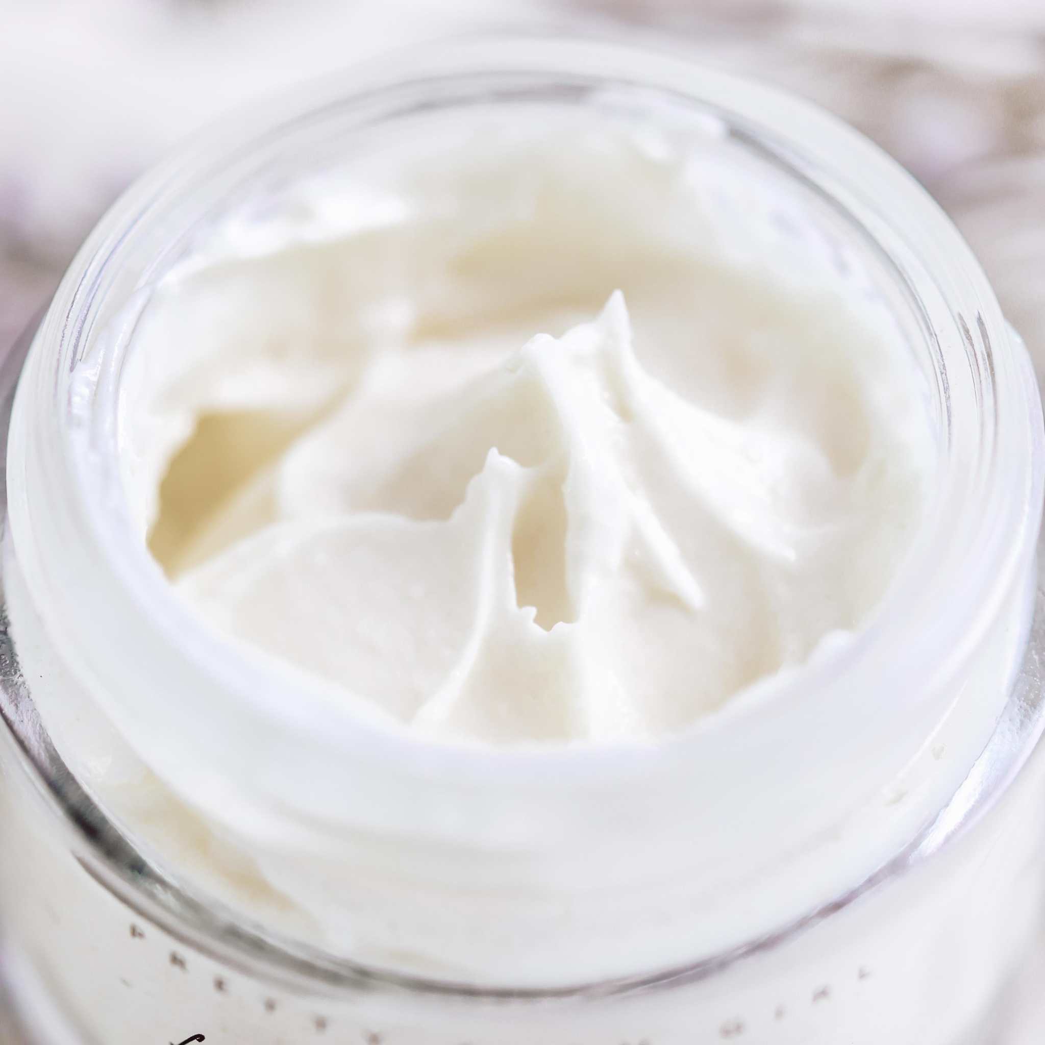Fresh Face Cream moisturizer with a rich white, whipped texture displayed in an open glass jar.