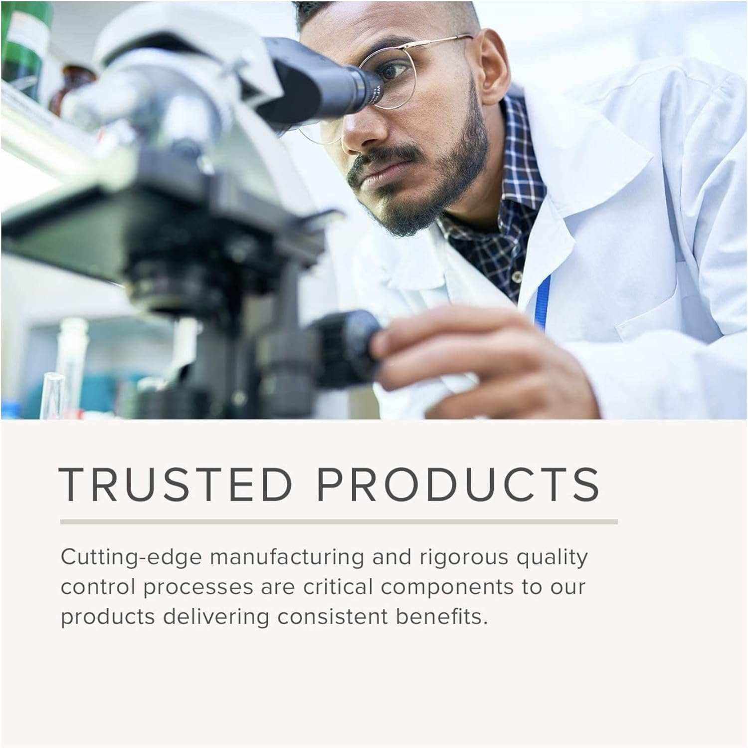 Scientist in white lab coat using microscope focused on research and quality control for Full Spectrum Multivitamin products
