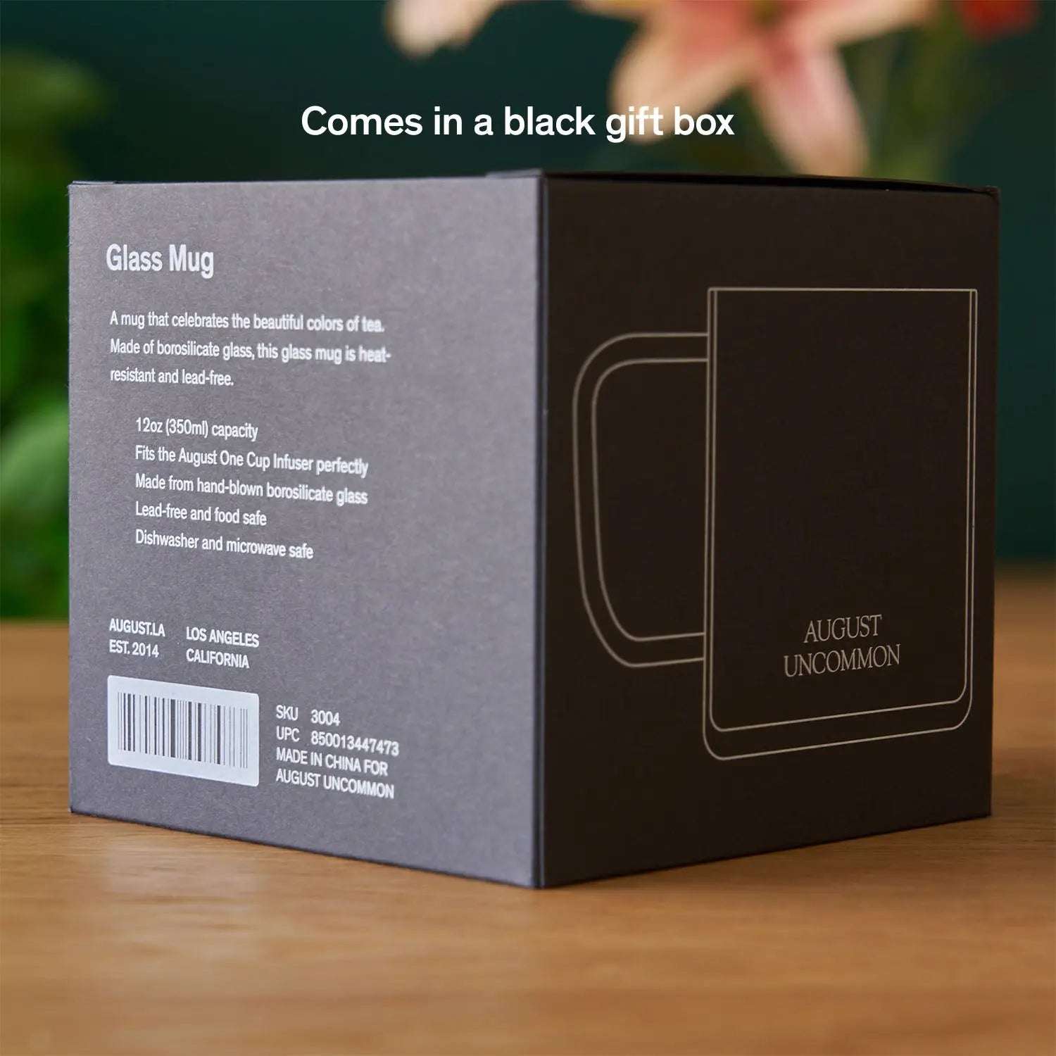 Glass Mug packaging in a black gift box, with a grey information panel and a white outlined mug design.