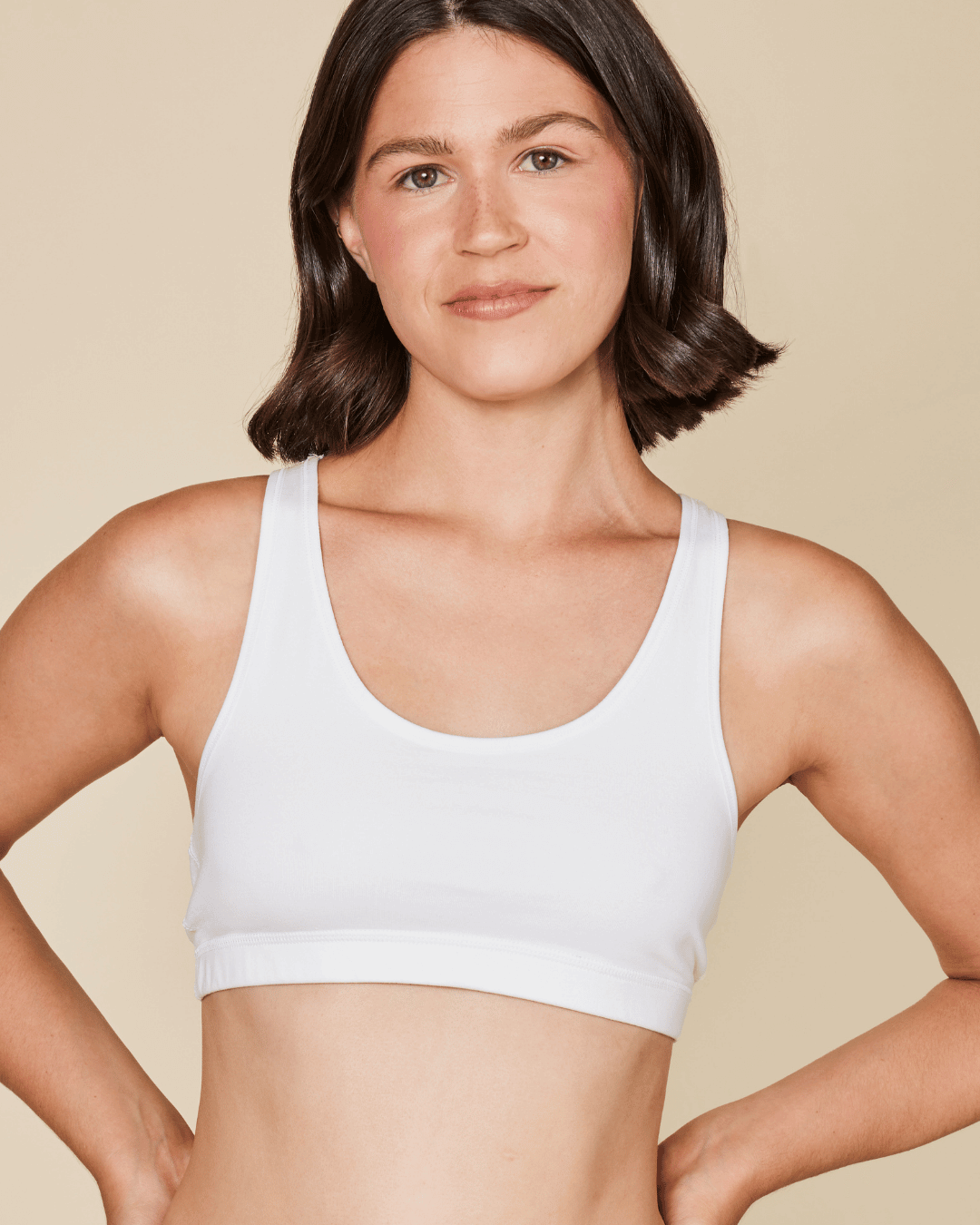 Glide Cotton Racerback Bralette in white, with a smooth cotton finish, wide straps, and a scoop neckline
