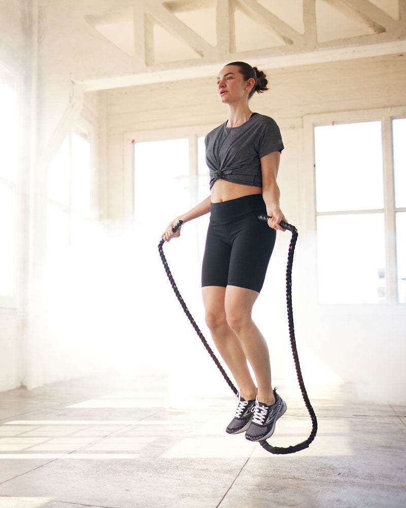 Go Again Bike Short black stretch knit compression shorts with a wide waistband and mid-thigh length