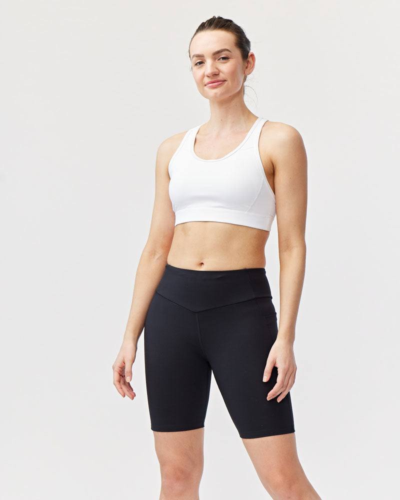 Go Again Bike Short in black stretch knit with a high double-layer waistband and fitted mid-thigh length