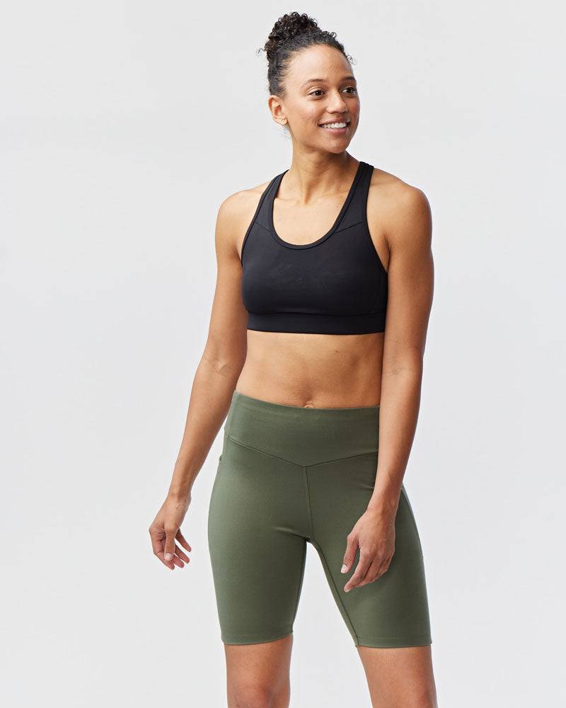 Go Again Bike Short in olive green stretch knit with a high waistband and fitted mid-thigh length
