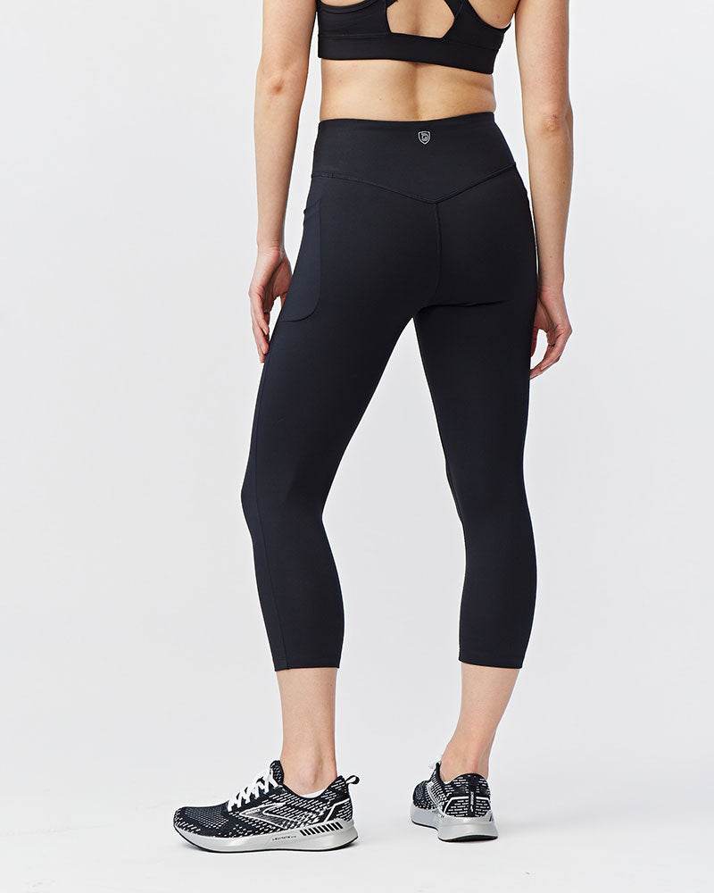 Go Again Crop Legging in black stretch fabric, featuring a high-rise waistband, cropped legs and subtle rear seam details