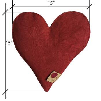 Heart-Shaped Pillow in deep red cotton denim with a softly textured surface and small fabric label
